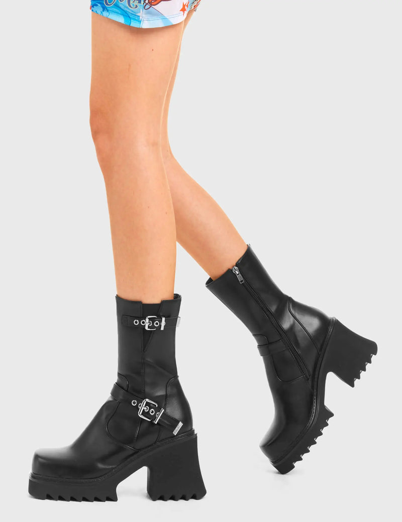 BUCKLED UP 
  
  New Mission Chunky Platform Ankle Boots in Black Faux Leather. These vegan western Boots feature Two silver square buckles and a shark teeth grip sole, very edgy. Made with eco-friendly materials and 100% cruelty-free, these boots are as ethical as they are Chic!
  
  
  - Chunky Platform
  - Calf length
  - Shark teeth grip
  - Two silver buckles
  - Adjustable straps
  - Rounded toe 
  - 100% vegan 
  
  SKU: LMF 3733 - BlackPU