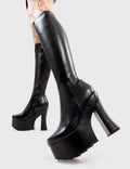 Not Your Basic Boots
  
  Night Vision Platform Knee High Boots in Black faux leather. These platform boots feature a minimalist design withj a curved heel, the perfect way to elevate any look. Made with eco-friendly materials and 100% cruelty-free, these platform boots are as ethical as they are cool.
  
  - Platform Height
  - Heel Height
  - Curved Heel
  - Black Zip
  - Shark's teeth grip
  - Chunky Platform sole
  - 100% vegan 
  
  SKU: LMF 2926 - BlackPU