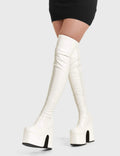 Solid Slammers
  
  Not Ready Chunky Platform Thigh High Boots in White faux leather. These white vegan Platform Boots feature on our chunky platform sole, make a statment and stomp with chunky elevation. Made with eco-friendly materials and 100% cruelty-free, these platform boots are as ethical as they are dominant!
  
  
  - Height: 1.8 inch
  - Heel height: 5.5 inch 
  - White zipper
  - Shark's teeth rubber grip 
  - Chunky platform sole
  - Square Toe
  - 100% vegan 
  
  SKU: LMF 2073 - WhitePU