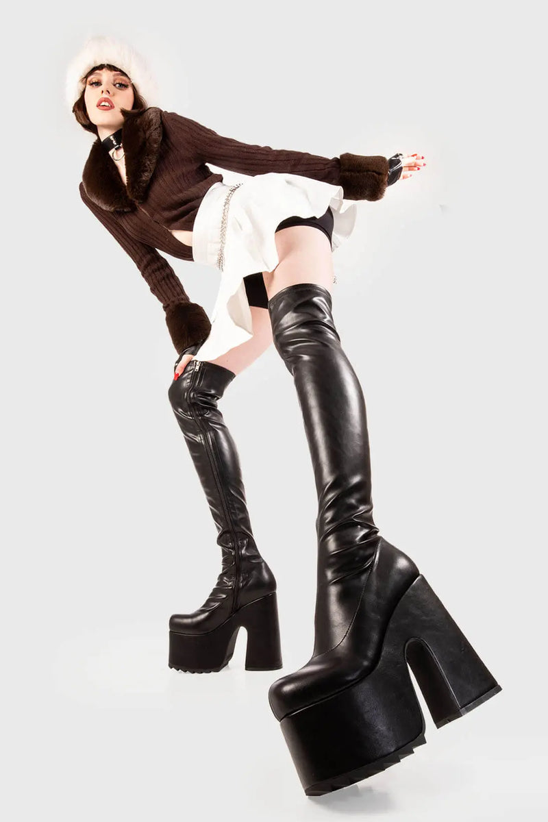 Solid Slammers
  
 Not Ready Chunky Platform Thigh High Boots in Black faux leather. These black vegan Platform Boots feature on our chunky platform sole, make a statment and stomp with chunky elevation. Made with eco-friendly materials and 100% cruelty-free, these platform boots are as ethical as they are dominant!
 
 
 - Platform Height
 - Heel Height 
 - Black zipper
 - Shark's teeth rubber grip 
 - Chunky platform sole
 - Round Toe
 - 100% vegan 
 
 SKU: LMF 2073 - BlackPU