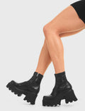 UPGRADE YOUR STYLE
  
  Notorious Chunky Platform Ankle Boots in Black fitted faux leather. These vegan western Boots feature a minimalist look with chunky soles, very classy. Made with eco-friendly materials and 100% cruelty-free, these boots are as ethical as they are edgy!
  
  
  - Chunky Platform
  - Ankle length
  - Rounded toe 
  - 100% vegan 
  
  SKU: LMF 3601 - LMF 3601 - BlackStretchPU