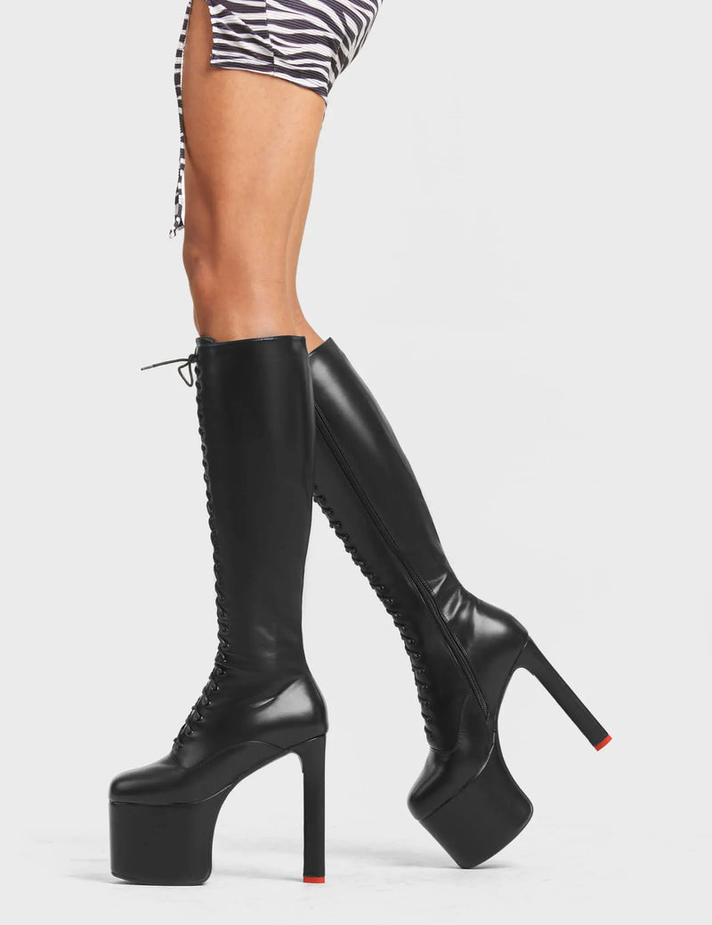 TRACKSTAR
  
  Nowhere To Run Platform Knee High Boots in Black faux leather. These platform boots feature a stylish look with a heart shaped heel with a red heart at the bottom. These boots also feature lace up design across the entire upper of the boots. Made with 100% Vegan materials.
  
  - Platform Height 
  - Knee High Length 
  - Heart Shaped Heel 
  - Red Heart Detail
  - Red Heart Detail 
  - Lace Up Design 
  - Black Zip 
  - High Heel 
  - 100% Vegan 
  
  SKU: LMF 4648 - BlackPU