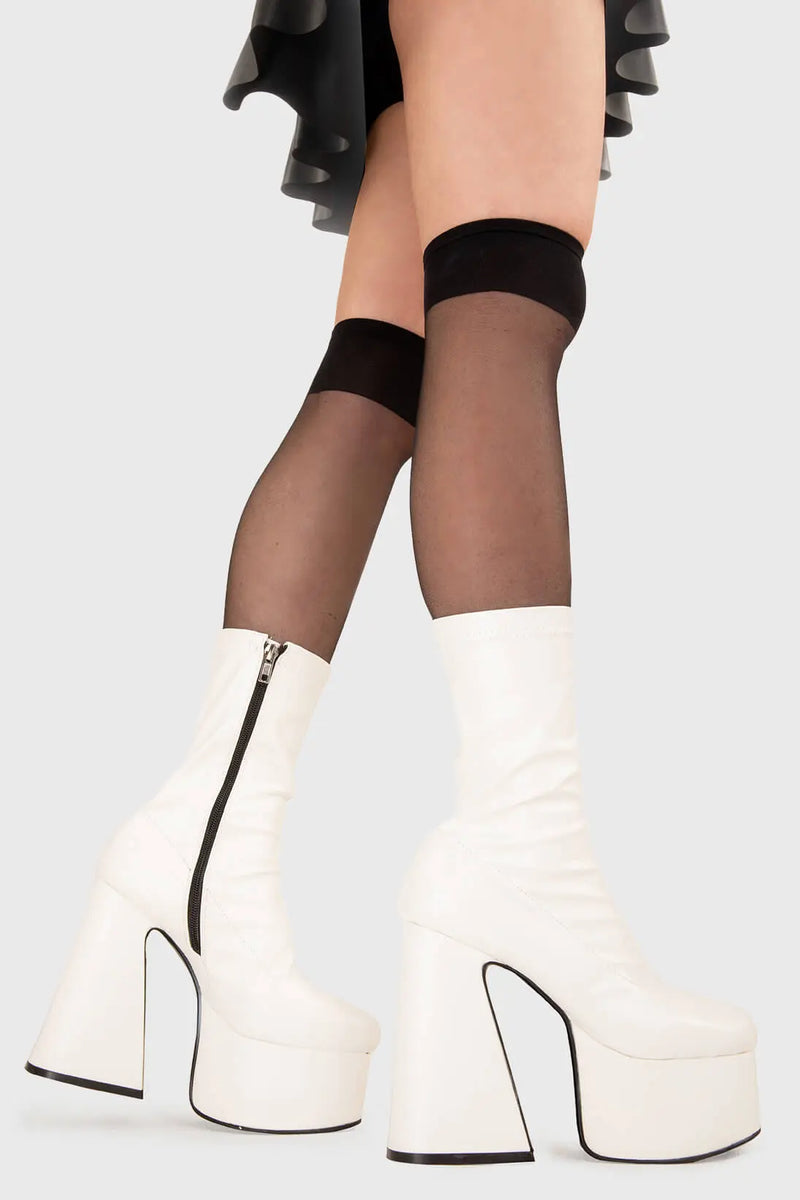ON THE CATWALK
  
  Over It Platform Ankle Boots in White fitting faux leather. These platform boots feature a minimalist look with a flared heel, keeping it nice and classy. Made with eco-friendly materials and 100% cruelty-free, these platform boots are as ethical as they are chic.
  
  - Platform Height
  - Ankle length
  - Fitted feel
  - Flared heel
  - High Heel
  - 100% vegan 
  
  SKU: LMF 3350 - WhiteStretchPU
