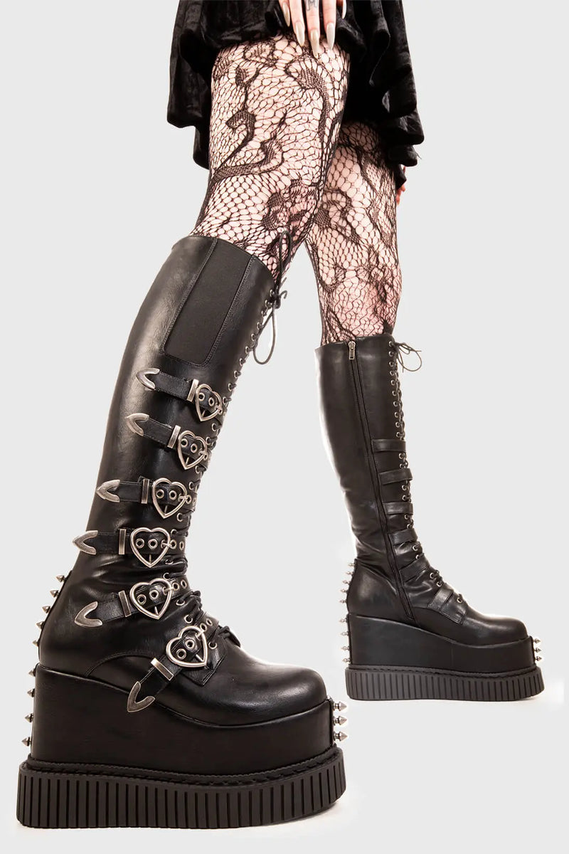 Grunge Goddess

Overkill Chunky Platform Knee High Boots in Black faux leather. These black vegan Platform Boots feature six adjustable black straps with heart shaped buckles and silver eyelets with lace up detail, rock the grunge scene. 

- Platform Height: 5.3 inch
- Black zipper 
- Black Laces 
- Black strap and silver eyelets
- Heart shaped buckles 
- Silver studs 
- Gusset detail
- Wide ankle and calf friendly 
- Chunky flatform creeper sole
- Round Toe
- 100% vegan 

SKU: LMF 1878 - BlackPU