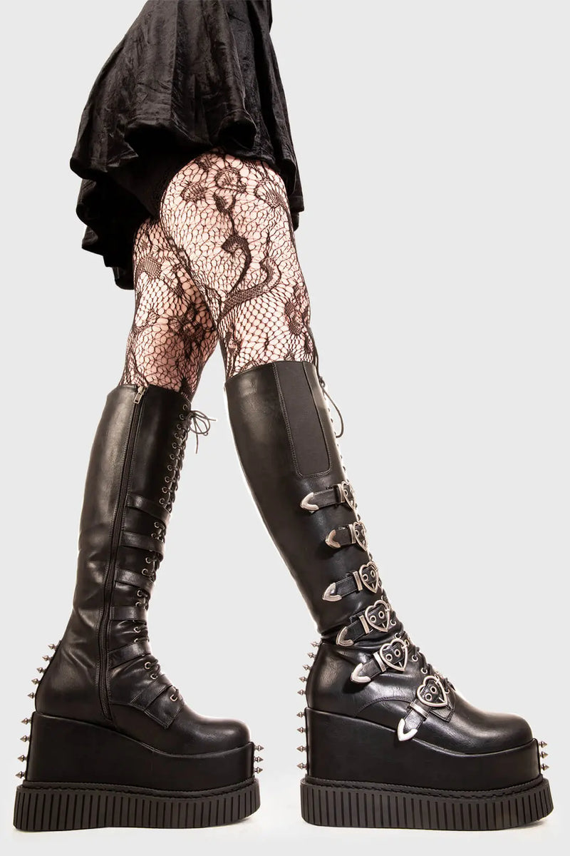 Grunge Goddess

Overkill Chunky Platform Knee High Boots in Black faux leather. These black vegan Platform Boots feature six adjustable black straps with heart shaped buckles and silver eyelets with lace up detail, rock the grunge scene. 

- Platform Height: 5.3 inch
- Black zipper 
- Black Laces 
- Black strap and silver eyelets
- Heart shaped buckles 
- Silver studs 
- Gusset detail
- Wide ankle and calf friendly 
- Chunky flatform creeper sole
- Round Toe
- 100% vegan 

SKU: LMF 1878 - BlackPU