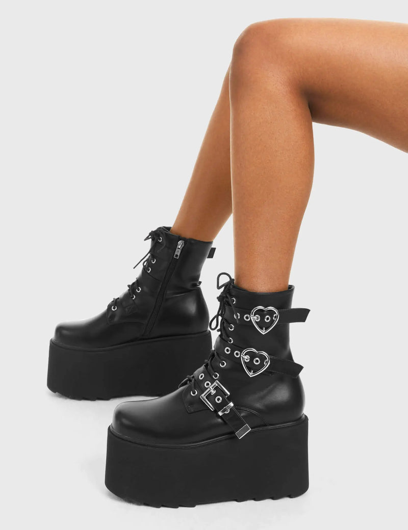 ELEVATED 
  
  Part Time Lover Chunky Platform Ankle Boots in Black Faux Leather. These vegan western Boots feature a two heart buckles and one square buckle with a chunky platform, very edgy. Made with eco-friendly materials and 100% cruelty-free, these boots are as ethical as they are Chic!
  
  
  - Chunky Platform
  - Ankle length
  - Two Heart Buckles
  - Square buckle Buckles
  - Adjustable straps
  - Two Heart Buckles
  - Rounded toe 
  - 100% vegan 
  
  SKU: LMF 3749 - BlackPU