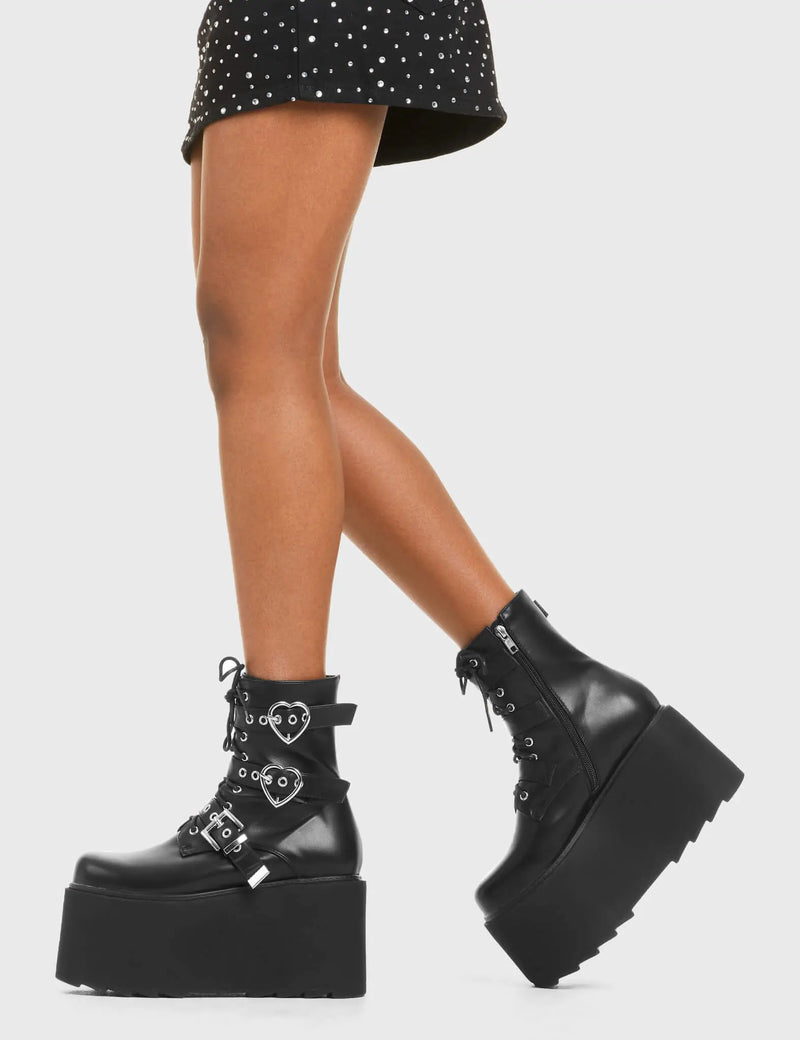 ELEVATED 
  
  Part Time Lover Chunky Platform Ankle Boots in Black Faux Leather. These vegan western Boots feature a two heart buckles and one square buckle with a chunky platform, very edgy. Made with eco-friendly materials and 100% cruelty-free, these boots are as ethical as they are Chic!
  
  
  - Chunky Platform
  - Ankle length
  - Two Heart Buckles
  - Square buckle Buckles
  - Adjustable straps
  - Two Heart Buckles
  - Rounded toe 
  - 100% vegan 
  
  SKU: LMF 3749 - BlackPU