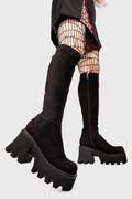 Sleek Sensations
  
  Ready Chunky Platform Knee High Boots in Black Suede. These black vegan Platform Boots feature on our chunky platform sole, simple steps with exceptional comfort! Made with eco-friendly materials and 100% cruelty-free, these platform boots are as ethical as they are comfortable!
  
  
  - Platform Height: 3.3 inch
  - Wide fit 
  - Black zipper 
  - Chunky Platform sole
  - Round Toe
  - 100% vegan 
  
  SKU: