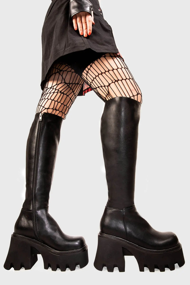 Sleek Sensations
  
  Ready Chunky Platform Knee High Boots in Black faux leather. These black vegan Platform Boots feature on our chunky platform sole, simple steps with exceptional comfort! Made with eco-friendly materials and 100% cruelty-free, these platform boots are as ethical as they are comfortable!
  
  
  - Platform Height
  - Black zipper 
  - Chunky Platform sole
  - Round Toe
  - 100% vegan 
  
  SKU: LMF 1986 - BlackPU