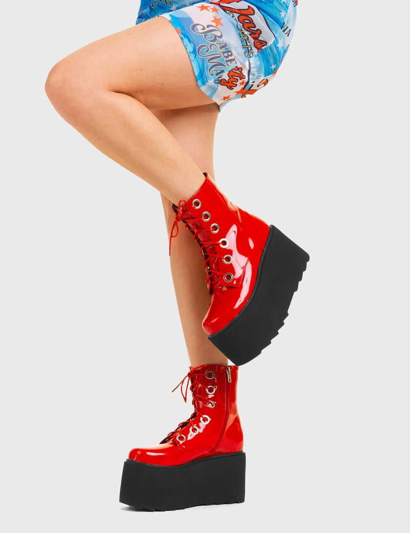 ELEVATED 
  
  Renegade Chunky Platform Ankle Boots in Red patent. These vegan western Boots feature silver eyelets and a shark teeth grip sole, very edgy. Made with eco-friendly materials and 100% cruelty-free, these boots are as ethical as they are Chic!
  
  
  - Chunky Platform
  - Ankle length
  - Shark teeth grip
  - Red Laces
  - Rounded toe 
  - 100% vegan 
  
  SKU: LMF 3746 - RedPAT