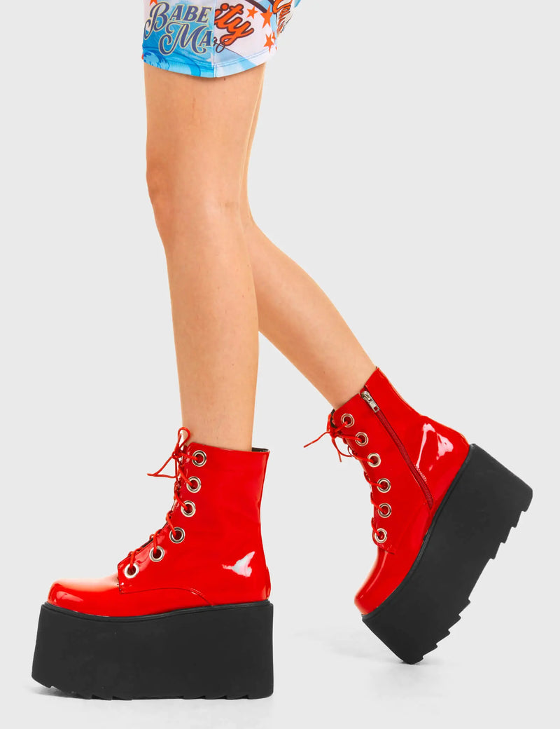 ELEVATED 
  
  Renegade Chunky Platform Ankle Boots in Red patent. These vegan western Boots feature silver eyelets and a shark teeth grip sole, very edgy. Made with eco-friendly materials and 100% cruelty-free, these boots are as ethical as they are Chic!
  
  
  - Chunky Platform
  - Ankle length
  - Shark teeth grip
  - Red Laces
  - Rounded toe 
  - 100% vegan 
  
  SKU: LMF 3746 - RedPAT