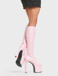 SHOWSTOPPER
  
  Rockstar Girlfriend Platform Knee High Boots in Pink faux leather. These platform boots feature a minimalist look with a stretchy construction. Features a heart shaped heel with a red heart at the bottom Made with eco-friendly materials and 100% cruelty-free, these platform boots are as ethical as they are chic.
  
  - Platform Height:
  - Heel Height: 
  - Knee high 
  - Red Heart
  - Heart heel
  - High Heel
  - 100% vegan 
  
  SKU: LMF 4646 - PinkStretchPU