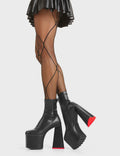 HEART TO HEART
  
  Rom-Com Platform Ankle Boots in Black fitted faux leather. These platform boots feature a minimalist look with a heart shaped heel and a red heart at the bottom, keeping it nice and classy. Made with eco-friendly materials and 100% cruelty-free, these platform boots are as ethical as they are chic.
  
  - Platform Height
  - Ankle Length
  - Fitted Feel
  - Red Heart
  - Heart Heel
  - High Heel
  - 100% Vegan
  
  SKU: LMF 5479 - BlackPU
