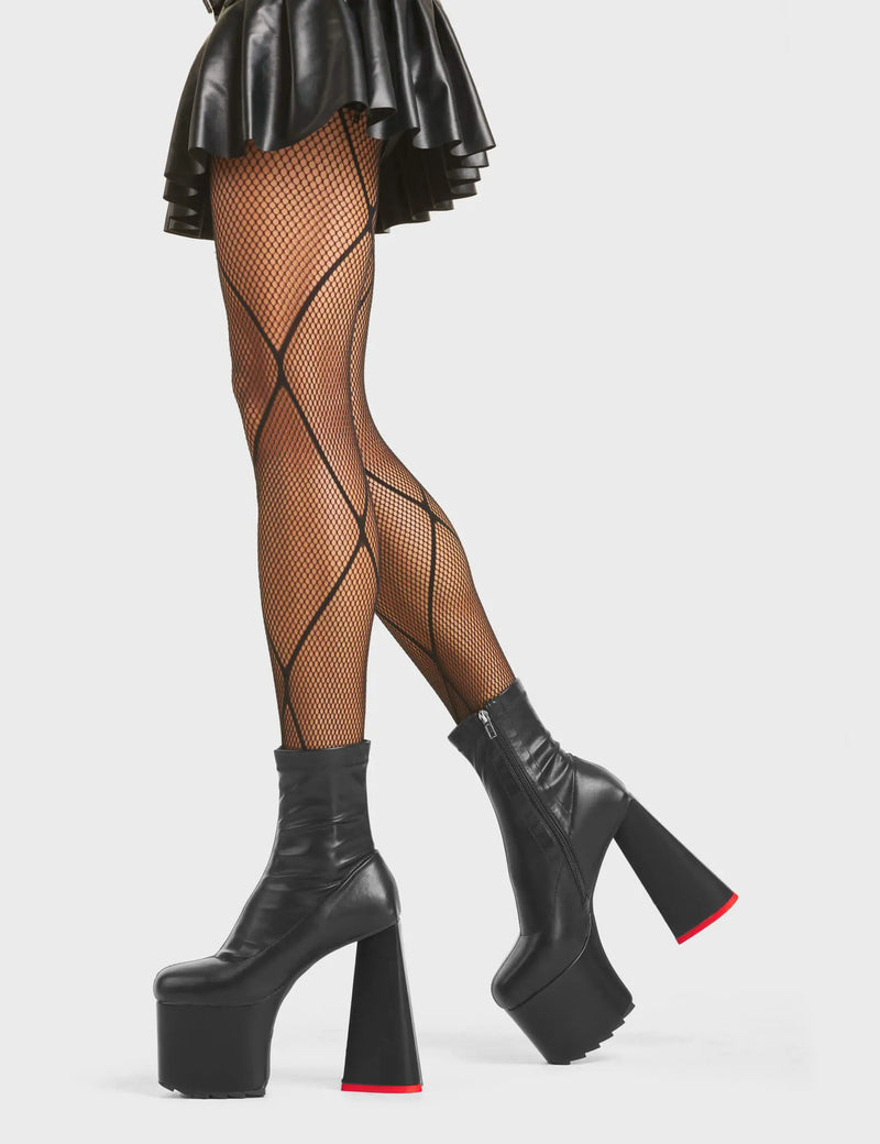 HEART TO HEART
  
  Rom-Com Platform Ankle Boots in Black fitted faux leather. These platform boots feature a minimalist look with a heart shaped heel and a red heart at the bottom, keeping it nice and classy. Made with eco-friendly materials and 100% cruelty-free, these platform boots are as ethical as they are chic.
  
  - Platform Height
  - Ankle Length
  - Fitted Feel
  - Red Heart
  - Heart Heel
  - High Heel
  - 100% Vegan
  
  SKU: LMF 5479 - BlackPU