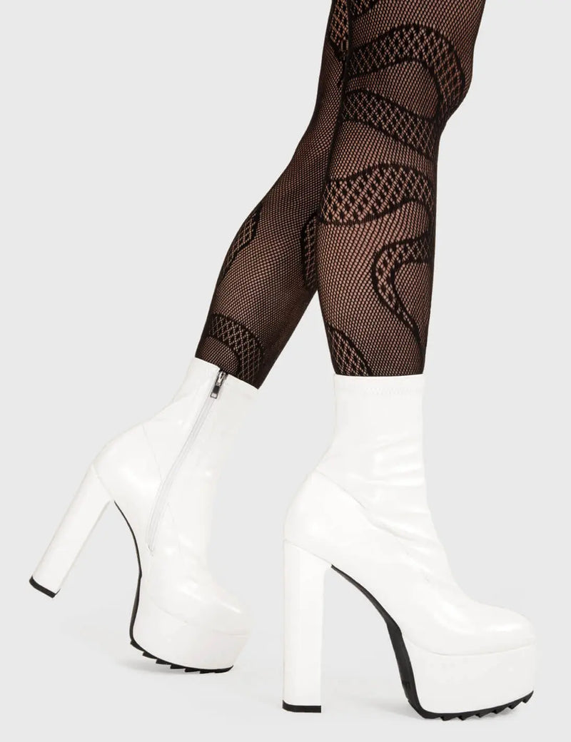Not Your Basic Boots!
  
  Rule Over Platform Ankle Boots in White faux leather. These platform boots feature a minimalist design, with a fitted feel on our platform sole and high heel. Made with eco-friendly materials and 100% cruelty-free, these platform boots are as ethical as they are Trendy.
  
  - Platform Height
  - Heel Height
  - White zip
  - fitted feel
  - High Heel
  - Platform Sole
  - Shark's Teeth Grip
  - 100% vegan 
  
  SKU: LMF 3109 - WhiteStretchPU