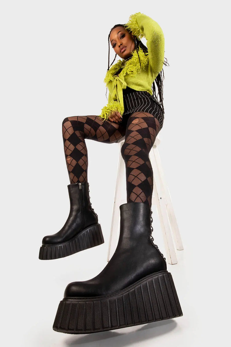 Clean and Crisp
  
  Say My Name Chunky Ankle Creeper Boots in Black faux leather. These black platform boots feature black lace up detail with silver eyelets towards the back, making a bold statment with each step.Made with eco-friendly materials and 100% cruelty-free, these platform boots are as ethical as they are Sleek!
  
  - Platform Height
  - Black zipper
  - Black laces and silver eyelets 
  - Chunky platform creeper wedge sole
  - Round Toe 
  - 100% vegan 
  
  SKU: LMF 2212 - BlackPU