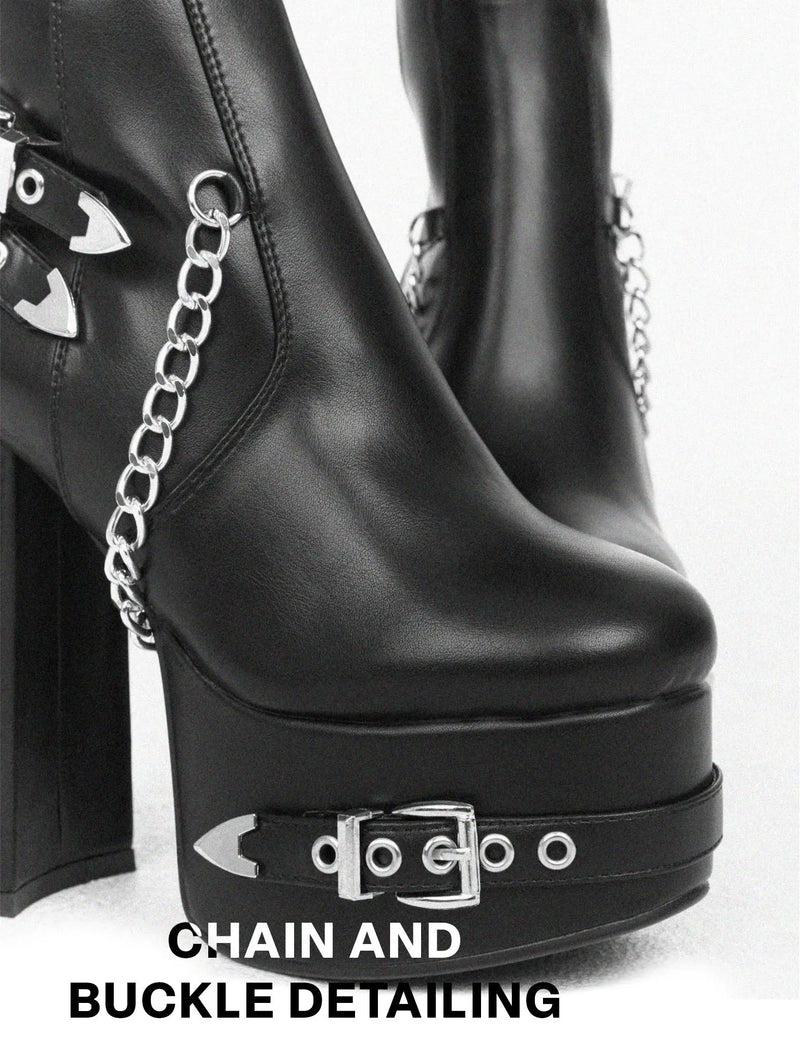 HERE AND NOW
  
  Scream Wide Calf Platform Thigh High Boots in Black faux leather. These vegan Boots feature Silver buckles, chains and spikes, making them the perfect comfy Boots. Made with eco-friendly materials and 100% cruelty-free, these boots are as ethical as they are comfy!
  
  
  - Thigh High length 
  - Silver spikes
  - Silver chains
  - Silver buckles
  - Skull face
  - Cunky Platform sole
  - Round toe 
  - 100% vegan 
  
  SKU: LMF 0988 - BlackPU - WIDE FIT