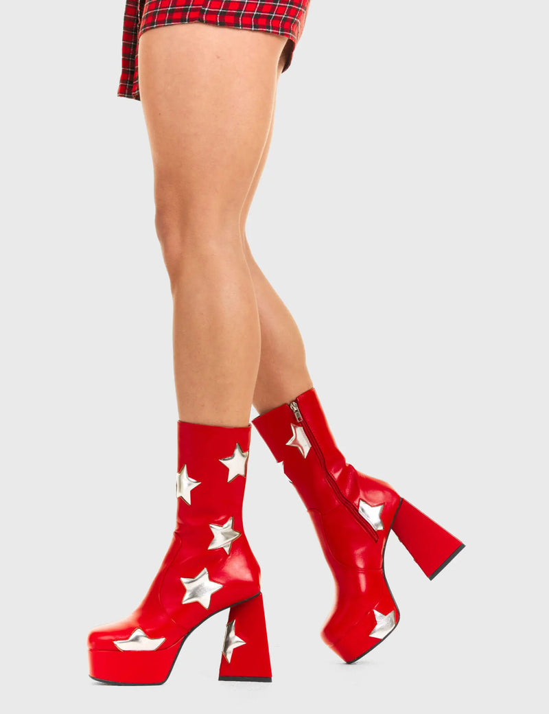 DISCO FEVER 
  
  Seeking Stars Platform Ankle Boots in Red faux leather. These platform boots feature a red boot with silver stars all over. Made with eco-friendly materials and 100% cruelty-free, these platform boots are as ethical as they are chic.
  
  - Platform Height
  - Silver stars
  - Calf length
  - Triangle heel
  - High Heel
  - 100% vegan 
  
  SKU: LMF 3338 - RedPU/SilverStar