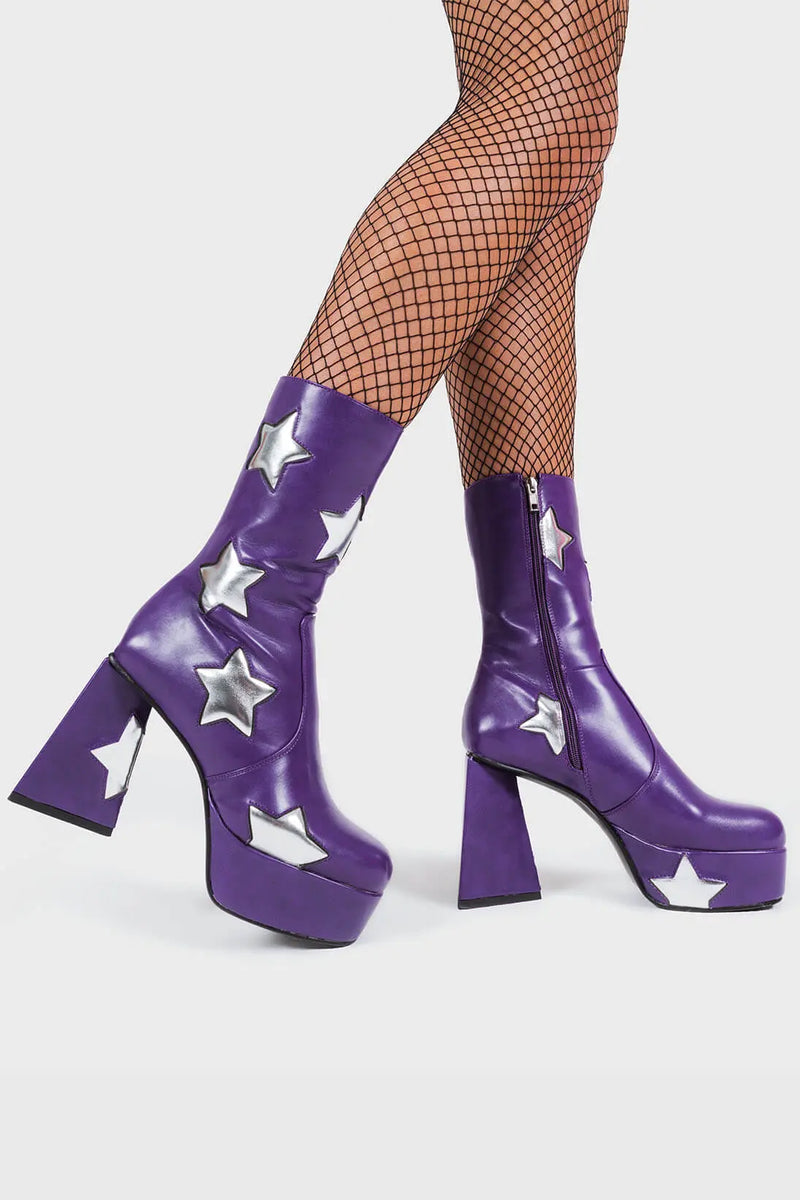 DISCO FEVER 
  
  Seeking Stars Platform Ankle Boots in Purple faux leather. These platform boots feature a purple boot with silver stars all over. Made with eco-friendly materials and 100% cruelty-free, these platform boots are as ethical as they are chic.
  
  - Platform Height
  - Silver stars
  - Calf length
  - Triangle heel
  - High Heel
  - 100% vegan 
  
  SKU: LMF 3338 - PurplePU/SilverStar