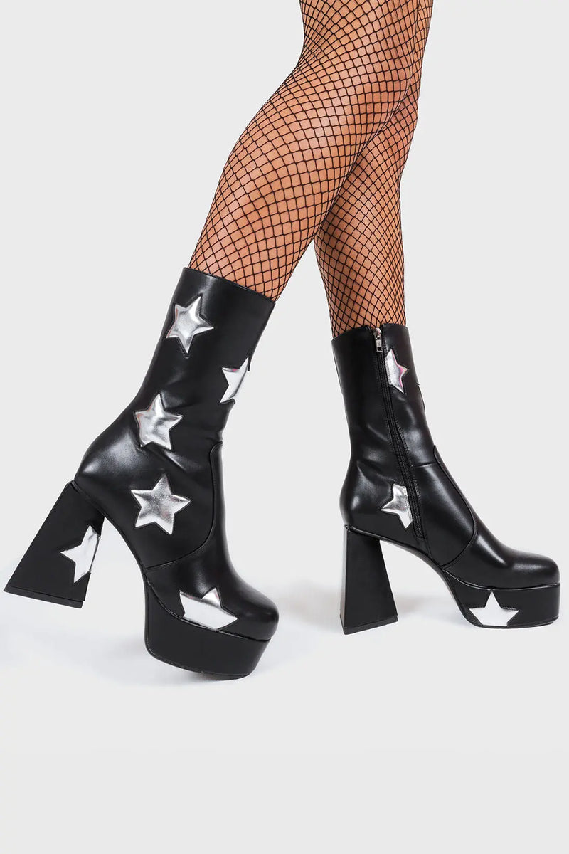 DISCO FEVER 
  
  Seeking Stars Platform Ankle Boots in Black faux leather. These platform boots feature a black boot with silver stars all over. Made with eco-friendly materials and 100% cruelty-free, these platform boots are as ethical as they are chic.
  
  - Platform Height
  - Silver stars
  - Calf length
  - Triangle heel
  - High Heel
  - 100% vegan 
  
  SKU: LMF 3338 - BlackPU/SilverStar