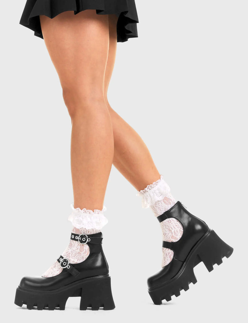 BUCKLED UP Slow Jamz Chunky Platform Ankle Boots in black faux leather. These platform boots feature two adjustable starps with silver buckles and eyelets. Made with eco-friendly materials and 100% cruelty-free, these platform boots are as ethical as they are chic. - Platform Height - Ankle length - Two adjustable straps - Silver buckles and eyelets - Rounded toe - High Heel - 100% vegan SKU: LMF 3600 - BlackPU