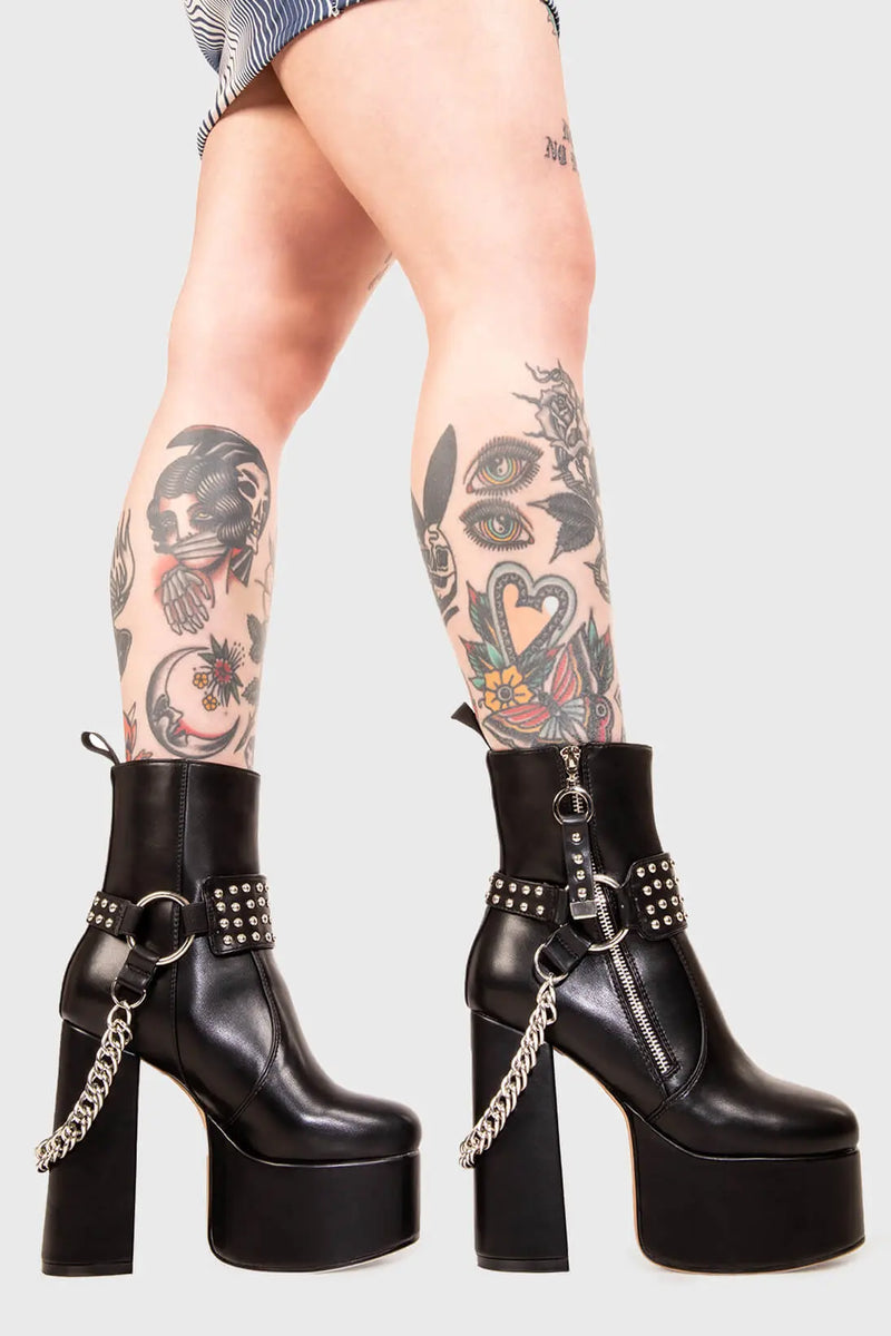BIKER GAL

So What Platform Ankle Boots in Black faux leather. These Platform Boots feature removable saddle with silver studs and a haning chain, making them the perfect choice to elevate your look! Made with eco-friendly materials and 100% cruelty-free, these boots are as ethical as they are wild!


- Platform Height: 2.5 inch
- Heel Height: 5.5 inch 
- Mid ankle length 
- Silver zipper
- Removable saddle
- Silver chain and studs
- High Platform sole
- Round toe 
- 100% vegan 

SKU: LMF 0150 - BlackPU