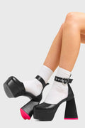 IN MY HEART AND MIND
  
  Sole Mate Platform Heels in Black faux leather. These platform boots feature a sliver heart buckle and a heart shaped heel, keeping it nice and classy. Made with eco-friendly materials and 100% cruelty-free, these platform boots are as ethical as they are chic.
  
  - Platform Height
  - Silver heart buckle
  - Adjustable straps
  - Pink sole
  - Shark teeth grip
  - heart shaped heel
  - High Heel
  - 100% vegan 
  
  SKU: LMF 3475 - BlackPU
