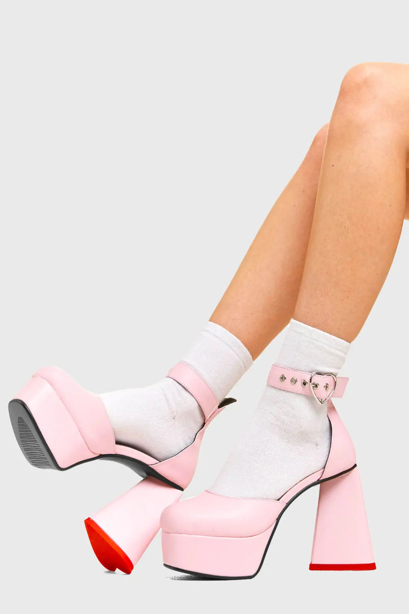 IN MY HEART AND MIND
  
  Sole Mate Platform Heels in Pink faux leather. These platform boots feature a sliver heart buckle and a heart shaped heel, keeping it nice and classy. Made with eco-friendly materials and 100% cruelty-free, these platform boots are as ethical as they are chic.
  
  - Platform Height
  - Silver heart buckle
  - Adjustable straps
  - Pink sole
  - Shark teeth grip
  - heart shaped heel
  - High Heel
  - 100% vegan 
  
  SKU: LMF 3475 - PinkPU