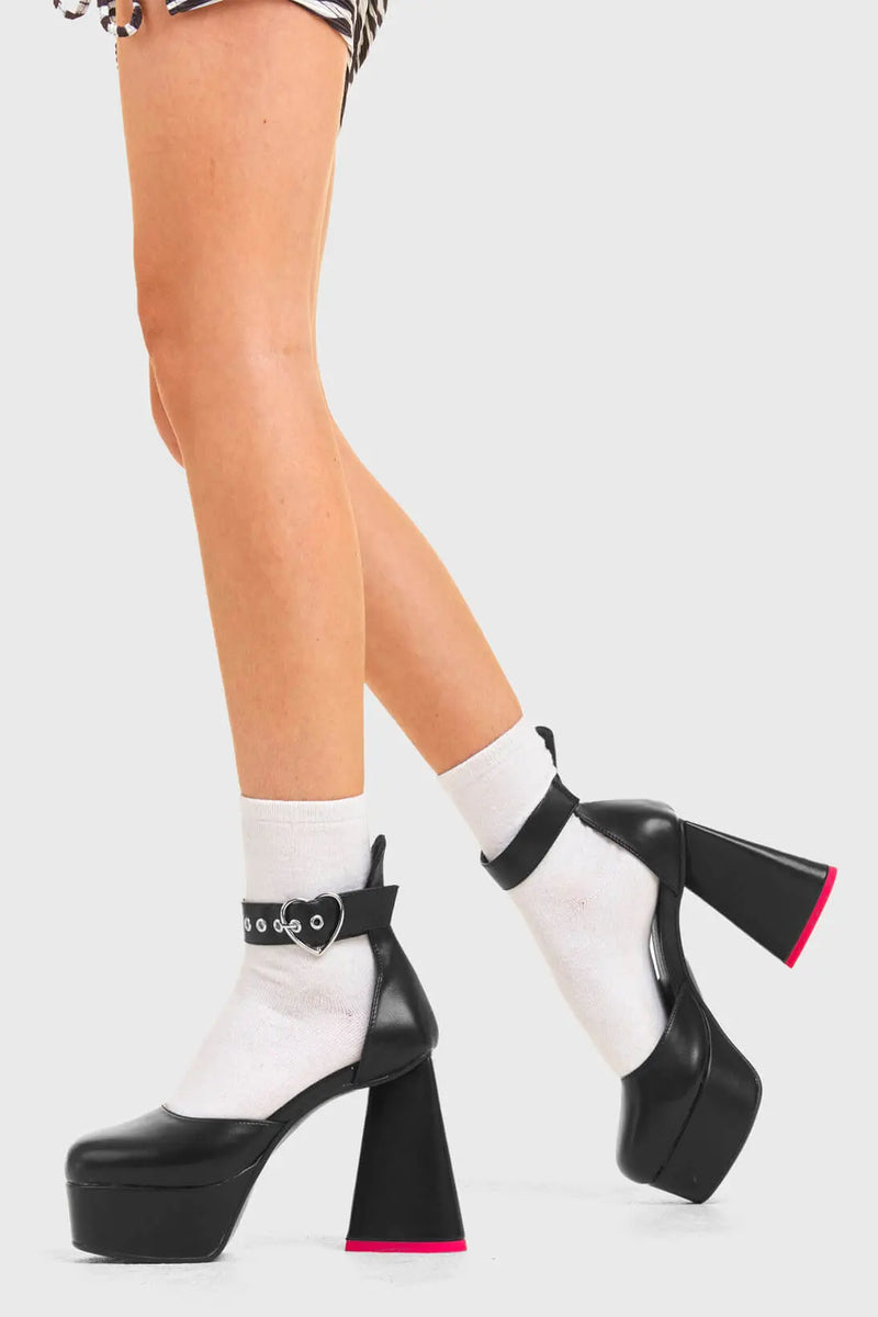 IN MY HEART AND MIND
  
  Sole Mate Platform Heels in Black faux leather. These platform boots feature a sliver heart buckle and a heart shaped heel, keeping it nice and classy. Made with eco-friendly materials and 100% cruelty-free, these platform boots are as ethical as they are chic.
  
  - Platform Height
  - Silver heart buckle
  - Adjustable straps
  - Pink sole
  - Shark teeth grip
  - heart shaped heel
  - High Heel
  - 100% vegan 
  
  SKU: LMF 3475 - BlackPU