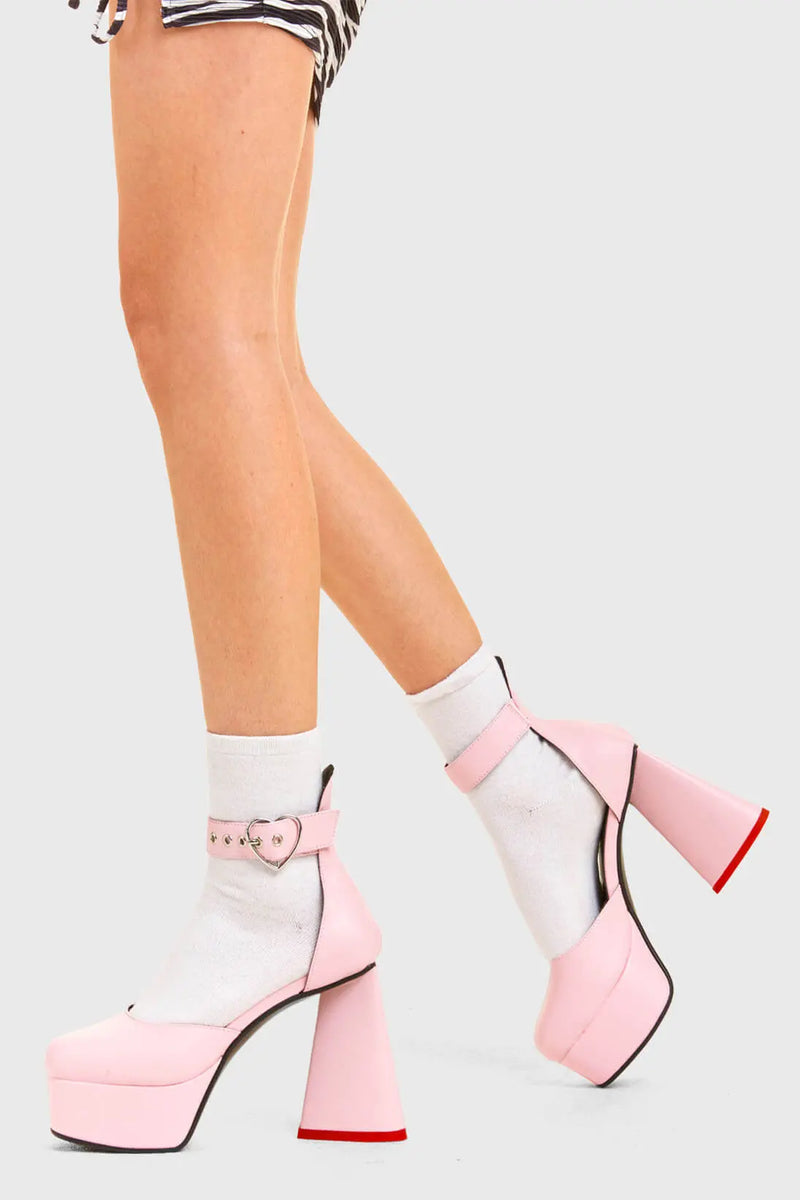 IN MY HEART AND MIND
  
  Sole Mate Platform Heels in Pink faux leather. These platform boots feature a sliver heart buckle and a heart shaped heel, keeping it nice and classy. Made with eco-friendly materials and 100% cruelty-free, these platform boots are as ethical as they are chic.
  
  - Platform Height
  - Silver heart buckle
  - Adjustable straps
  - Pink sole
  - Shark teeth grip
  - heart shaped heel
  - High Heel
  - 100% vegan 
  
  SKU: LMF 3475 - PinkPU