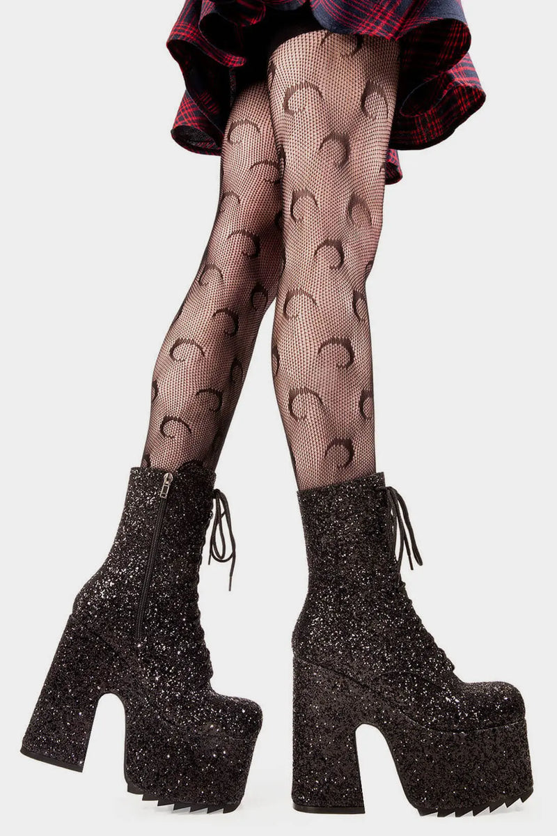Dazzling Delights
 
Spotlight Chunky Platform Ankle Creeper Boot in Black Glitter. These black vegan Platform Boots feature our iconic glitter detail througout with adjustable lace up detail, shiny perfection to glow with every step. Made with eco-friendly materials and 100% cruelty-free, these platform boots are as ethical as they are Radiant!


- Platform Height
- Heel Height 
- Black zipper 
- Black laces and silver eyelets 
- Chunky Creeper sole
- Round Toe
- 100% vegan 

SKU: LMF 2046 - BlackGlitter