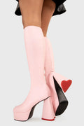 LOVEABLE 
  
  Sweet Talker Platform Knee High Boots in Pink faux leather. These platform boots feature a minimalist look with a heart shaped heel, keeping it nice and classy. Made with eco-friendly materials and 100% cruelty-free, these platform boots are as ethical as they are chic.
  
  - Platform Height
  - Knee length
  - Heart shaped heel
  - Red sole
  - Pink zip
  - High Heel
  - 100% vegan 
  
  SKU: LMF 3313 - PinkPU