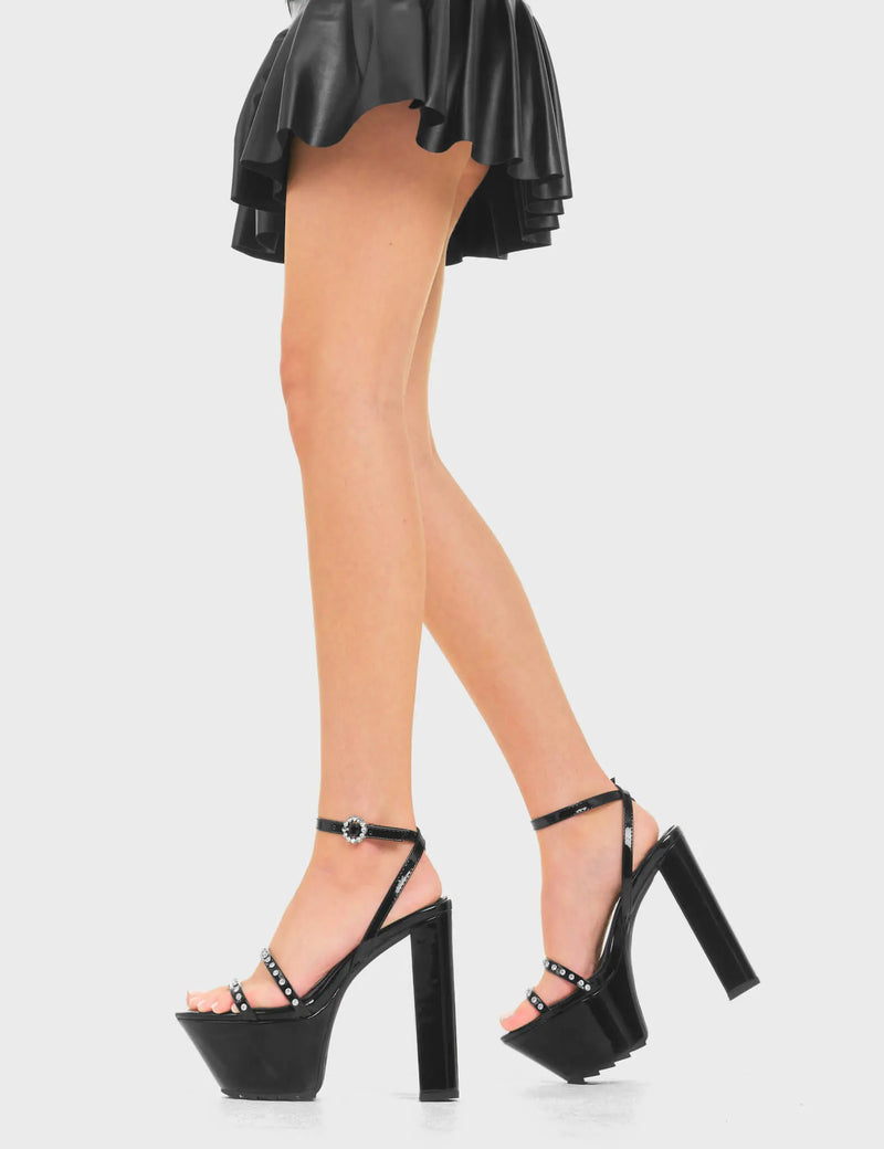 ADULTING
  
  Teenage Fantasy Platform Sandals in Black Patent. These heels features a adjustable Black ankle strap with a silver buckle. Also features silver metal studs on a open toe design. Slay with these platform heels. Made with eco-friendly materials and 100% cruelty-free!
  
  - Platform Height
  - Heel Height
  - Adjustable ankle strap
  - Silver buckle
  - Shark's teeth grip
  - Chunky Platform sole
  - Silver stud design
  - Open Toe 
  - 100% vegan 
  
  SKU: LMF 3810 - BlackPAT