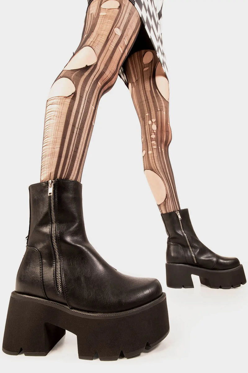 Trendsetter 
  
  Tell Me Lies Chunky Platform Boots. These black vegan Platform Boots feature on our chunky platform sole, comfortable , classic and all round confident. Made with eco-friendly materials and 100% cruelty-free, these platform boots are as ethical as they are cute!
  
  
  - Platform Height: 3 inch
  - Silver zipper 
  - Chunky Platform sole
  - Round Toe
  - 100% vegan 
  
  SKU: LMF 1845 - BlackPU