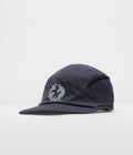 The Trilogy Tapes Clogged Bear Running Cap in Metallic Navy and Black
