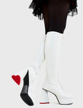 SO IN LOVE
  
  Too Cute Platform Knee High Boots in White faux leather. These platform boots feature a minimalist look with a heart shaped heel, keeping it nice and classy. Made with eco-friendly materials and 100% cruelty-free, these platform boots are as ethical as they are chic.
  
  - Platform Height
  - Knee length
  - Heart shaped heel
  - Lace up
  - Red sole
  - White zip
  - High Heel
  - 100% vegan 
  
  SKU: LMF 3314 - WhitePU