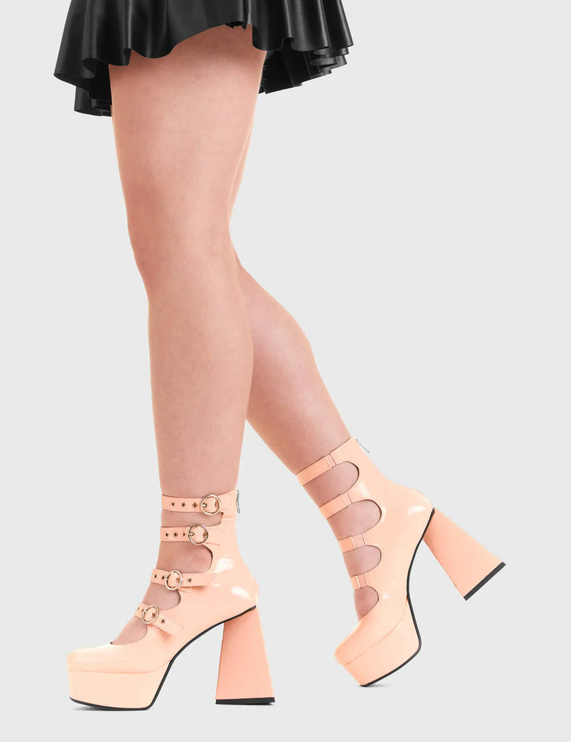 BUCKLED UP
  
  True Romance Platform Heels in Pink patent. These platform boots feature four silver buckles with adjustable straps, keeping it nice and classy. Made with eco-friendly materials and 100% cruelty-free, these platform boots are as ethical as they are edgy.
  
  - Platform Height
  - Silver circle buckles
  - Adjustable straps
  - Triangle heel
  - High Heel
  - 100% vegan 
  
  SKU: LMF 3328 - PinkPAT