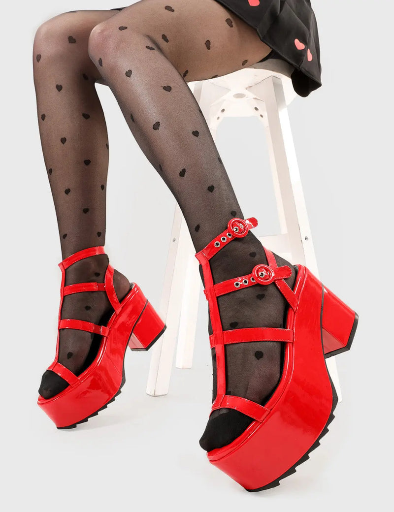 Dreamy Heights
  
  Turquoise Breeze Chunky Platform Sandals in Red patent faux leather. These platform sandals feature an adjustable red strap detail with silver eyelets, perfect balance of style and cuteness. Made with eco-friendly materials and 100% cruelty-free, these platform boots are as ethical as they are Comfortable.
  
  - Platform Height
  - Heel Height
  - Adjustable red strap
  - Silver eyelets with 'O' shaped buckle
  - Chunky Platform sole
  - Shark's teeth grip
  
  SKU: LMF 2537 - RedPAT