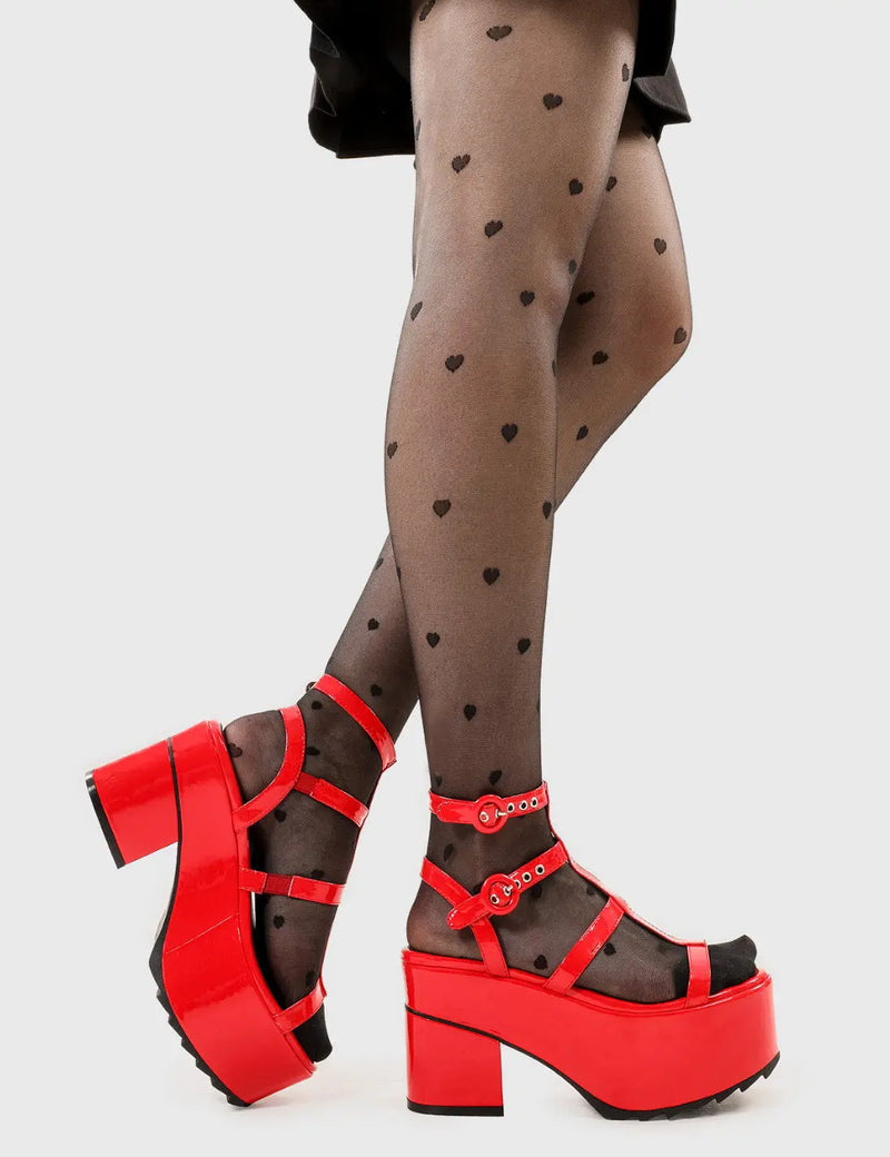 Dreamy Heights
  
  Turquoise Breeze Chunky Platform Sandals in Red patent faux leather. These platform sandals feature an adjustable red strap detail with silver eyelets, perfect balance of style and cuteness. Made with eco-friendly materials and 100% cruelty-free, these platform boots are as ethical as they are Comfortable.
  
  - Platform Height
  - Heel Height
  - Adjustable red strap
  - Silver eyelets with 'O' shaped buckle
  - Chunky Platform sole
  - Shark's teeth grip
  
  SKU: LMF 2537 - RedPAT