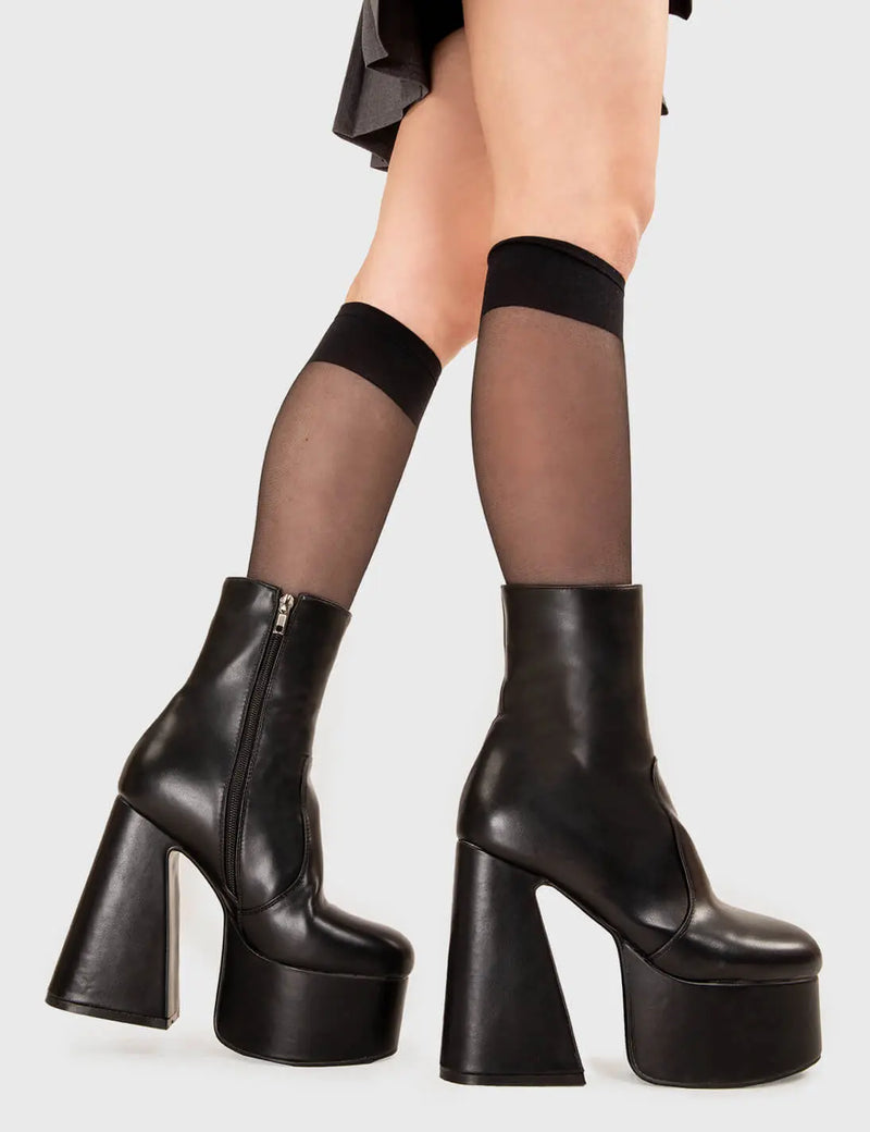 NOT YOUR AVERAGE BOOT
  
  Under Cover Platform Ankle Boots in Black faux leather. These platform boots feature a minimalist look with a flared heel, keeping it nice and classy. Made with eco-friendly materials and 100% cruelty-free, these platform boots are as ethical as they are chic.
  
  - Platform Height
  - Ankle length
  - Flared heel
  - High Heel
  - 100% vegan 
  
  SKU: LMF 3349 - BlackPU