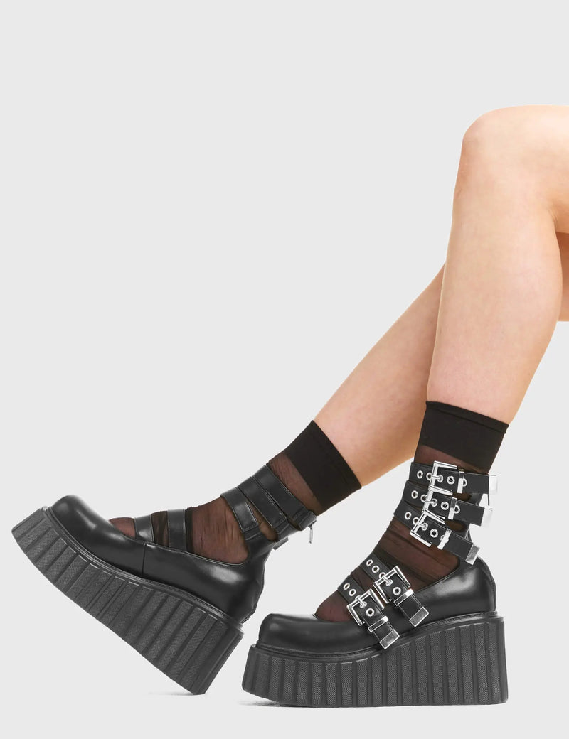 BUCKLED UP Under The Influence Chunky Platform Creeper Shoes in Black Faux Leather. These vegan western Boots feature silver buckles and five adjustable straps, very classy. Made with eco-friendly materials and 100% cruelty-free, these boots are as ethical as they are edgy! - Chunky Platform - Ankle length - Five adjustable straps - Silver buckles - Silver eyelets - Rounded toe - 100% vegan SKU: LMF 3616 - BlackPU