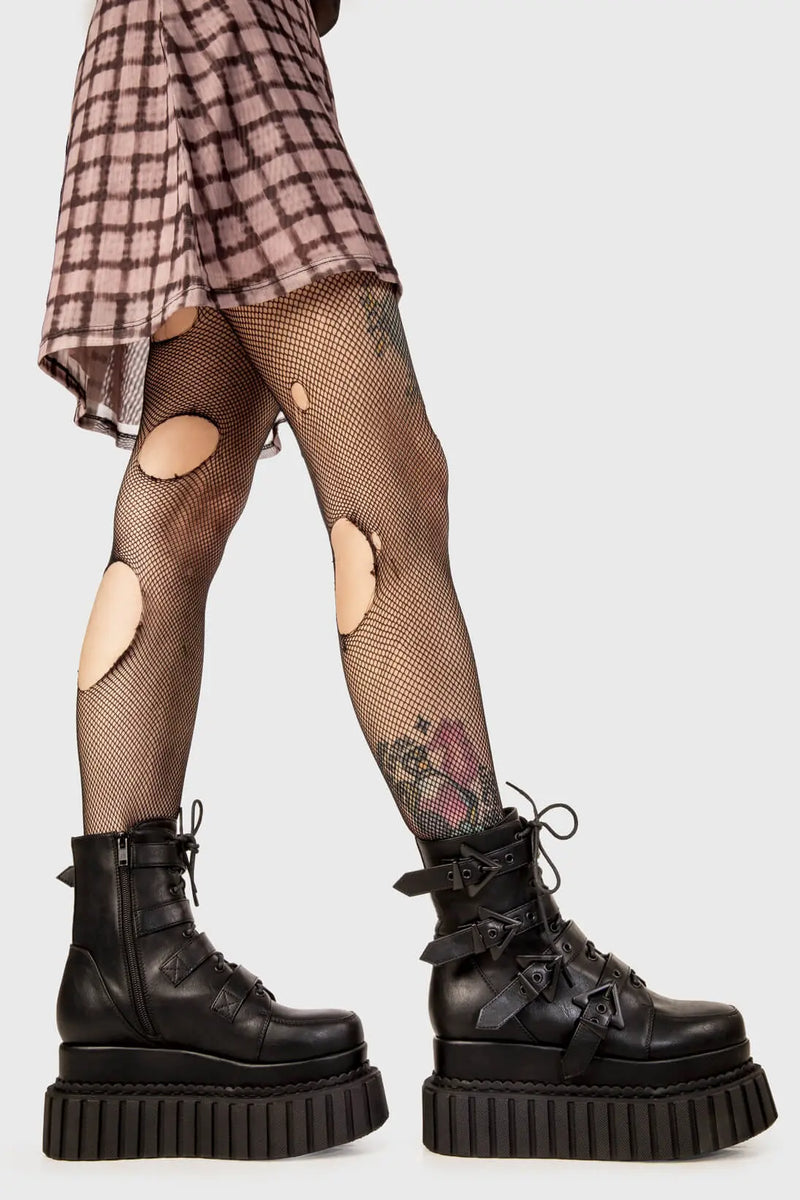 Solid Stompers
  
  Unstable Chunky Ankle Creeper Boots in black faux leather. These black Creeper Boots feature four adjustable black straps with triangular shaped buckles with black lace up detail, let the boots do the talking. Made with eco-friendly materials and 100% cruelty-free, these platform boots are as ethical as they are BOLD!
  
  - Platform Height: 5.4 inch
  - Four black straps
  - Black laces
  - Black eyelets and triangular shaped buckles
  - Chunky creeper sole
  
  SKU: LMF 2183 - BlackPU