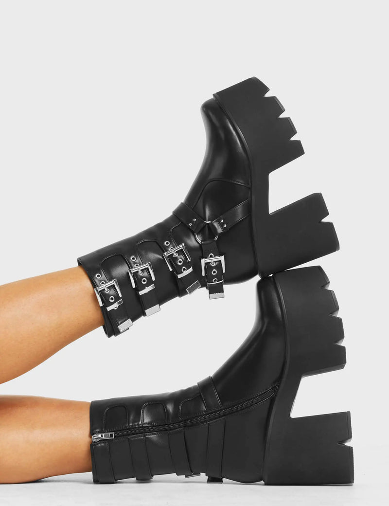 NOTHING BUT VIBES
  
  Vibetech Chunky Platform Ankle Boots in Black faux leather. These Platform Ankle Boots feature four adjustable straps with silver buckles on a chunky and comfortable platform sole. Made with eco-friendly materials and 100% cruelty-free, these Ankle Boots are as ethical as they are badass!
  
  
  - Platform Height:
  - Square Buckles
  - Silver Eyelets
  - Chunky Platform Sole
  - Black zipper
  - 'O' Rng Detail
  - 100% vegan
  
  SKU: LMF 5016 - BlackPU