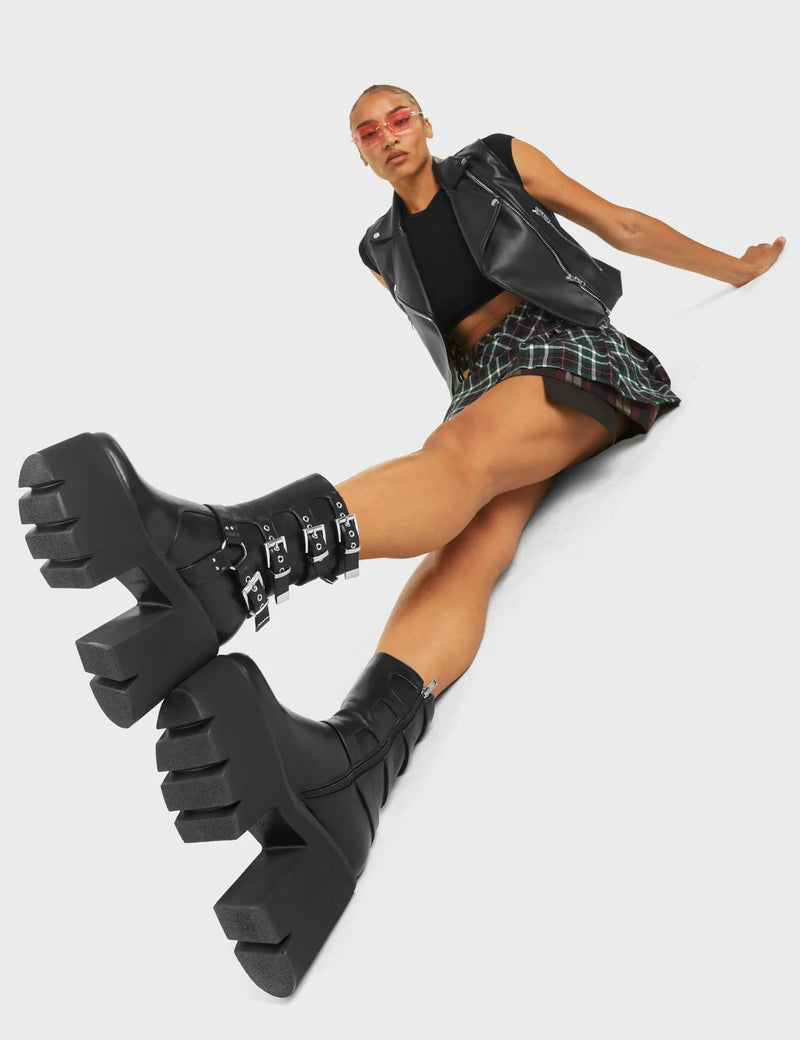 NOTHING BUT VIBES
  
  Vibetech Chunky Platform Ankle Boots in Black faux leather. These Platform Ankle Boots feature four adjustable straps with silver buckles on a chunky and comfortable platform sole. Made with eco-friendly materials and 100% cruelty-free, these Ankle Boots are as ethical as they are badass!
  
  
  - Platform Height:
  - Square Buckles
  - Silver Eyelets
  - Chunky Platform Sole
  - Black zipper
  - 'O' Rng Detail
  - 100% vegan
  
  SKU: LMF 5016 - BlackPU