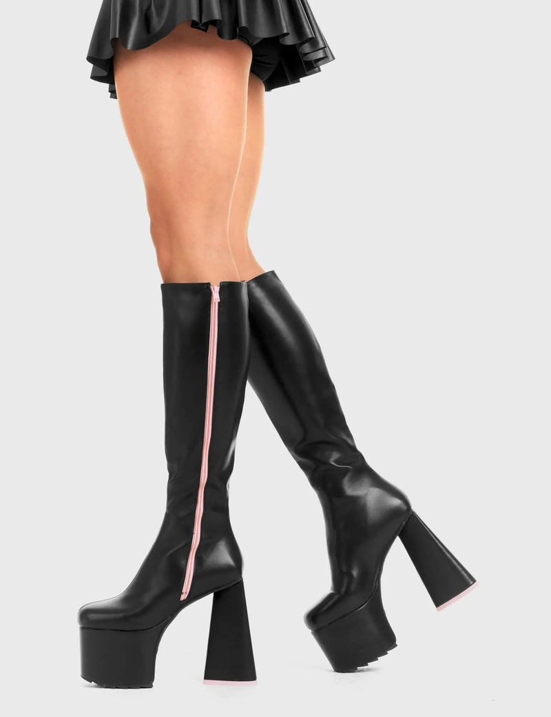 PEACE AND LOVE
  
  Wild Child Platform Knee High Boots in Black Faux Leather. These vegan western Boots feature heart shaped heel, with a red sole and shark teeth grips, very classy. Made with eco-friendly materials and 100% cruelty-free, these boots are as ethical as they are edgy!
  
  
  - Chunky Platform heels
  - Knee length
  - Shark teeth grip
  - Heart shaped heel
  - Pink heel sole
  - Rounded toe 
  - 100% vegan 
  
  SKU: LMF 3634 - BlackPU/Pink