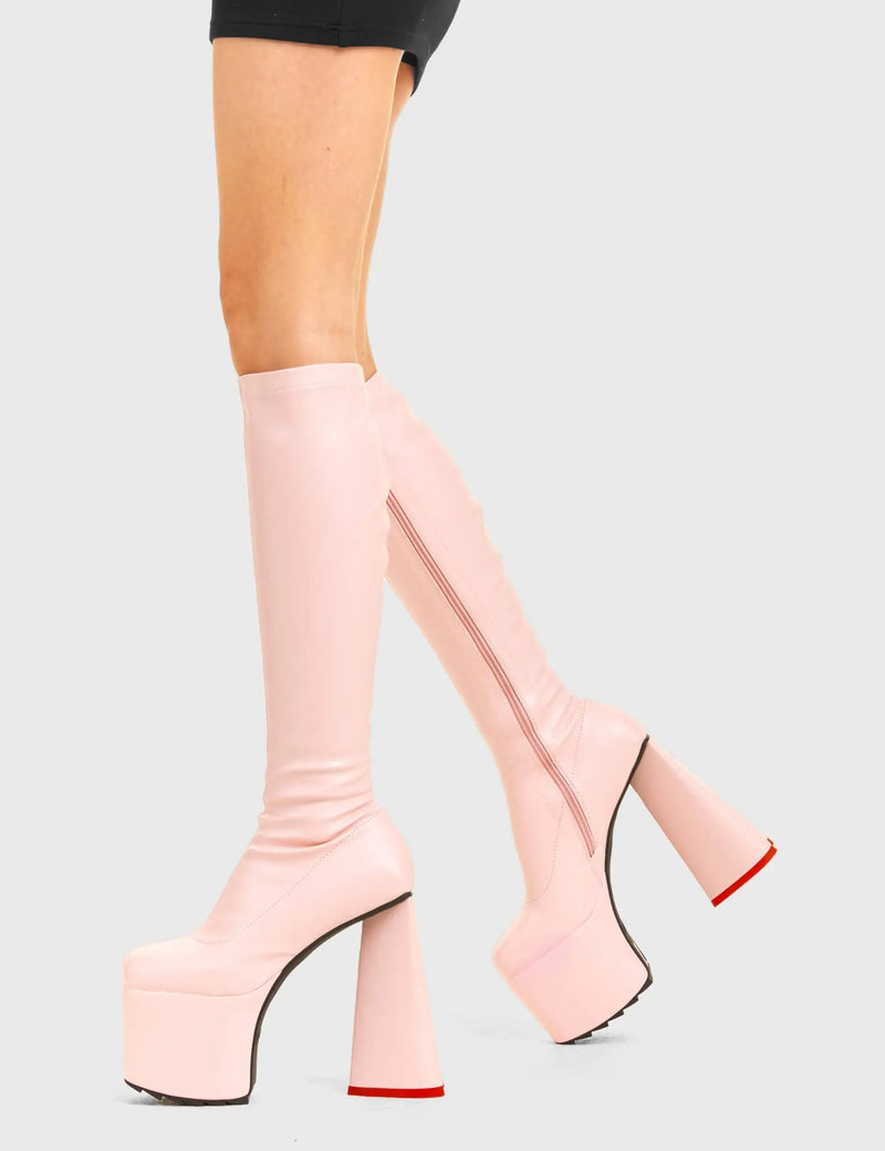 PEACE AND LOVE
  
  Wild Child Platform Knee High Boots in Pink Fitted Faux Leather. These vegan western Boots feature heart shaped heel, with a red sole and shark teeth grips, very classy. Made with eco-friendly materials and 100% cruelty-free, these boots are as ethical as they are edgy!
  
  
  - Chunky Platform
  - Knee length
  - Shark teeth grip
  - Fitted feel
  - Heart shaped heel
  - Red heel sole
  - Rounded toe 
  - 100% vegan 
  
  SKU: LMF 3633 - PinkStretchPU