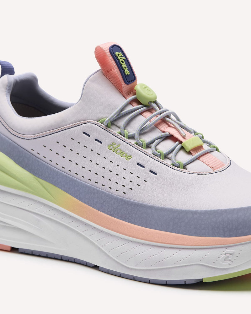 Gray athletic shoe with colorful accents on a white background