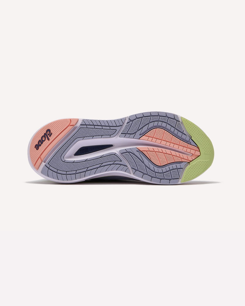 Gray athletic shoe with pink and green accents on a white background